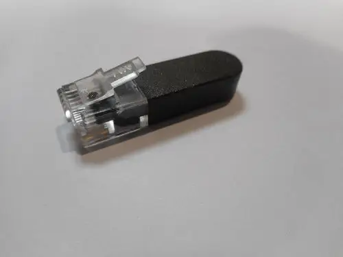 Endwiderstand in Schwarz mit transparentem Gehäuse, abgebildet auf einem weißen Hintergrund. Produkt von Remeha, zur Verwendung in S-Bus-Systemen.